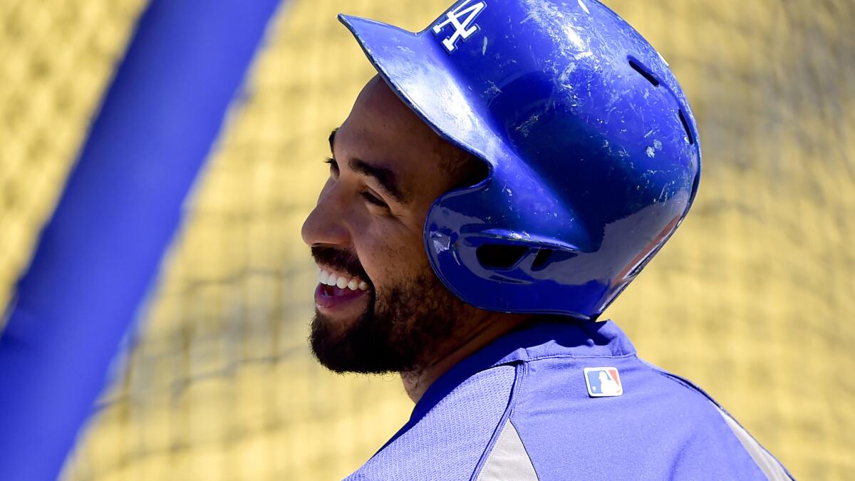 Dodgers outfielder Matt Kemp laughs during batting practice before a game against the Washington Nationals on Sept. 1, 2014.