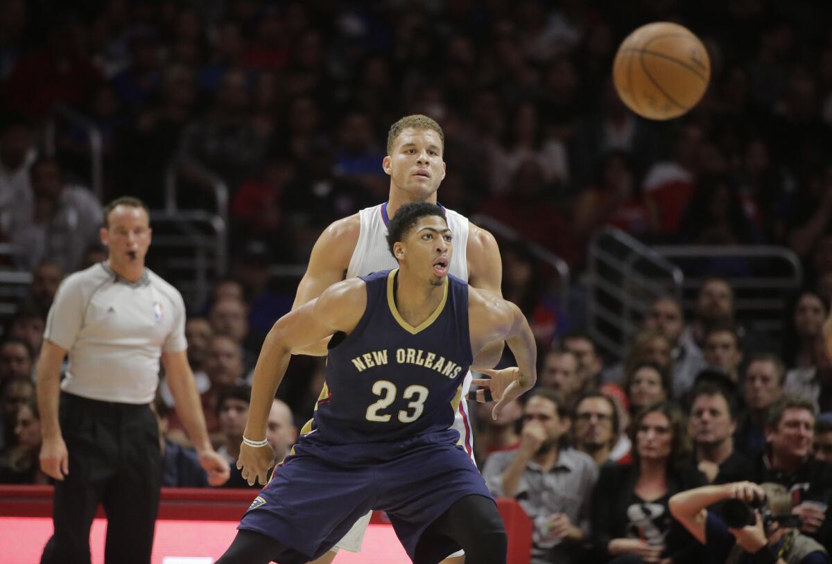 New Orleans' Anthony Davis, front, is pressured by Clippers' Blake Griffin back in December.