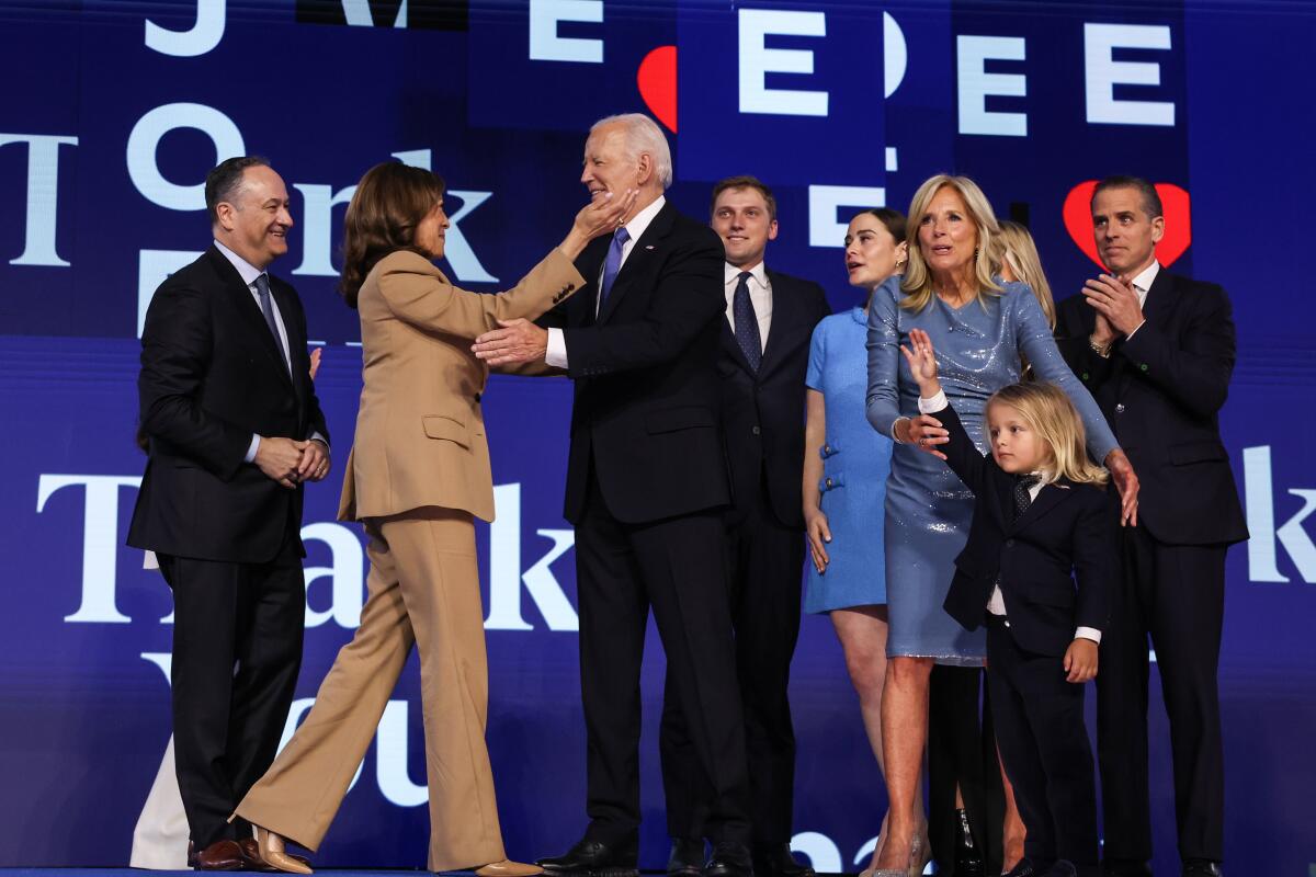 Vice President Kamala Harris hugs President Biden after his speech at the Democratic National Convention.