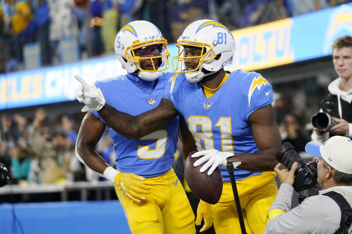 Chargers wide receiver Mike Williams, right, celebrates with wide receiver Joshua Palmer after catching a touchdown pass.