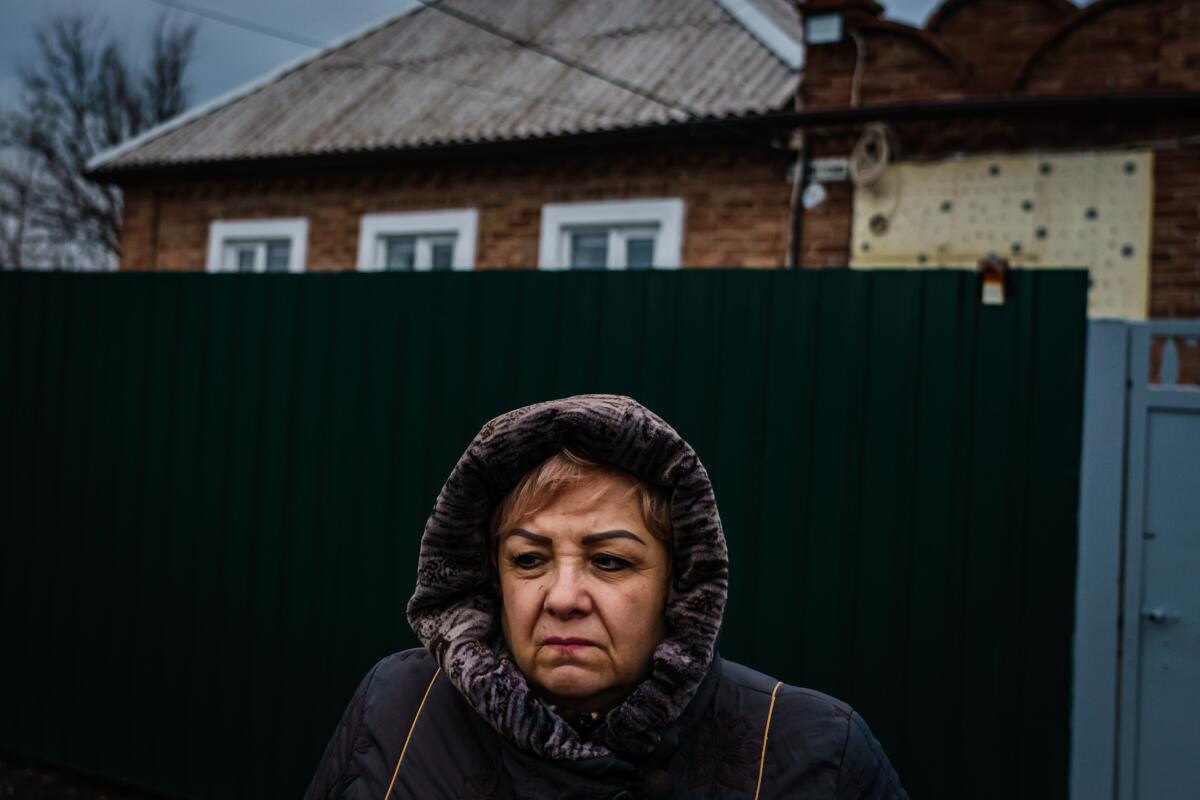 Irina Federovna, 60, a pensioner, outside her home in New York, Ukraine