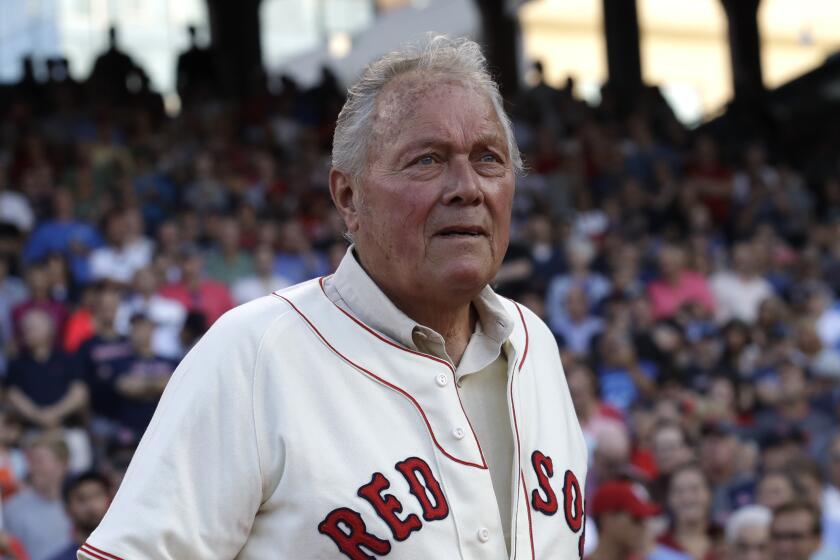 Boston Red Sox great Mike Ryan is honored prior to a baseball game in Boston, Wednesday, Aug. 16, 2017. (AP Photo/Charles Krupa)