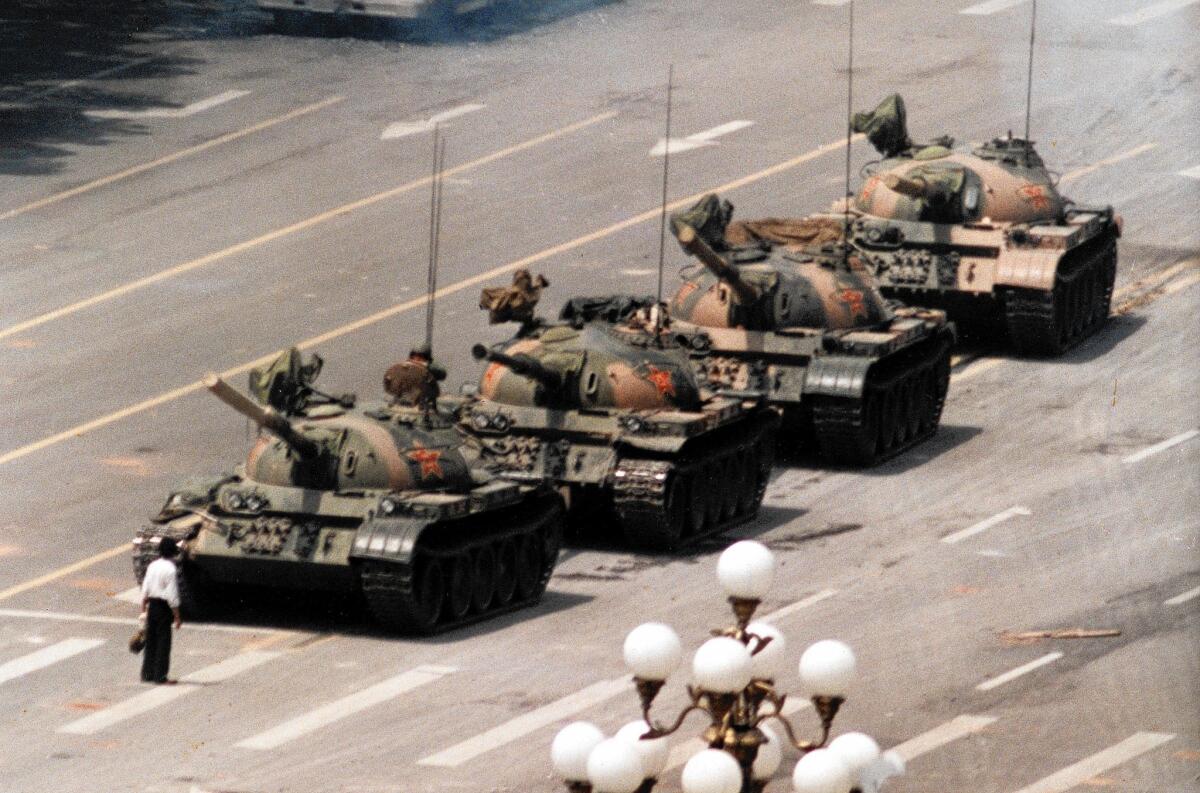 A lone man stands in the path of tanks on Beijing's Avenue of Eternal Peace on June 5, 1989, during the crackdown on Tiananmen Square demonstrations.
