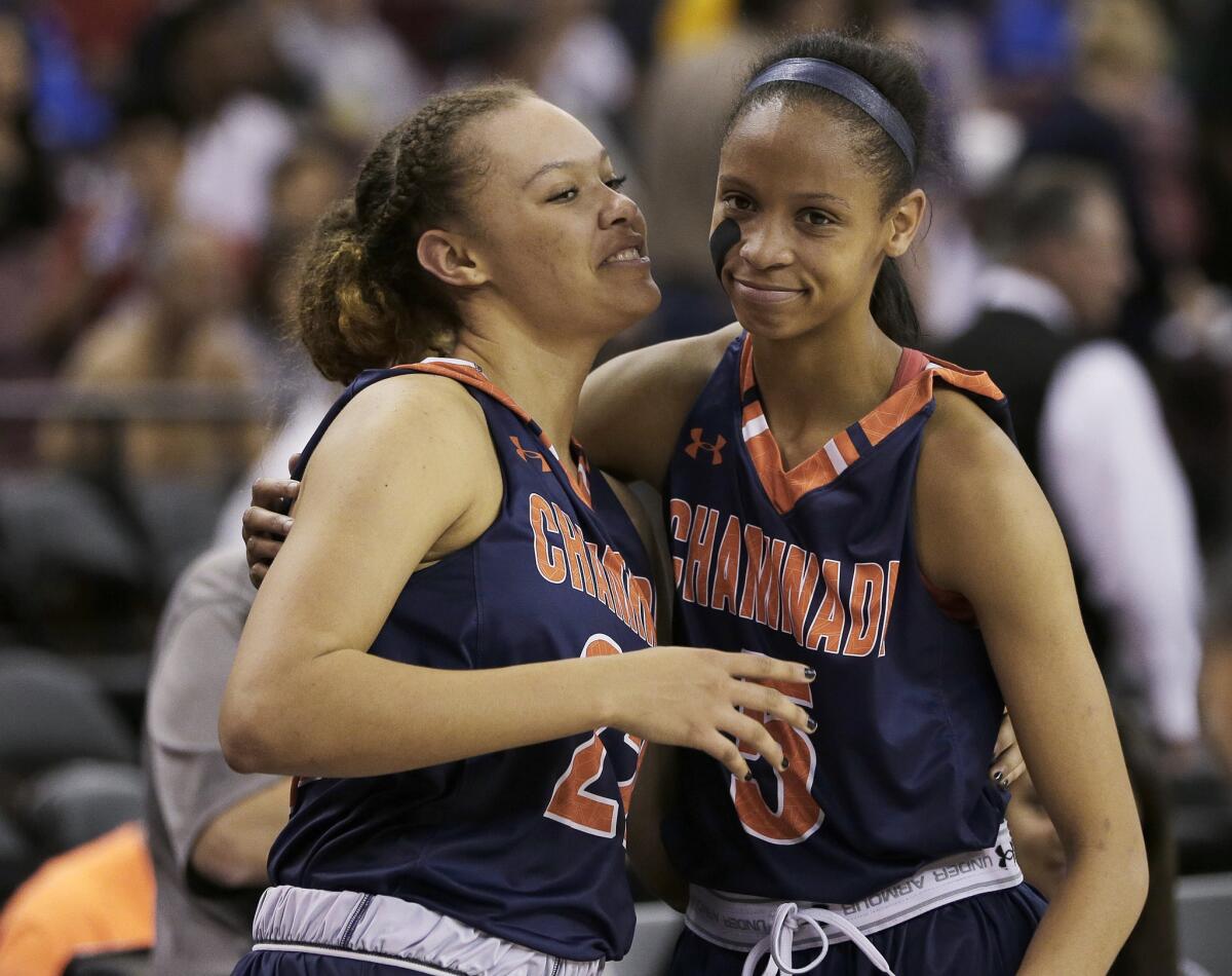 Valerie Higgins, left, and Leaonna Odam celebrate after Chaminade defeated Miramonte, 80-71, in the CIF girls' Open Division high school basketball championship on March 26.