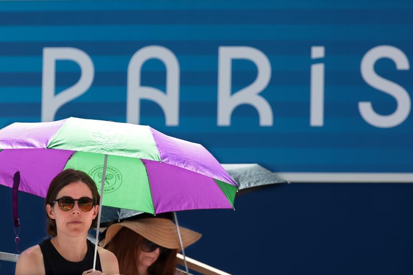PARIS, FRANCE July 31, 2024-Fans try to stay cool at Roland Garros.
