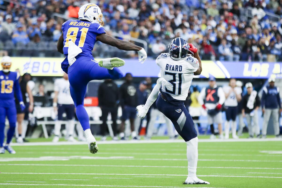 Titans safety Kevin Byard intercepts a pass intended for the Chargers' Mike Williams.