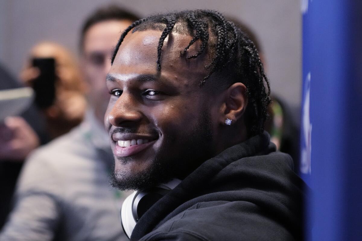 Bronny James smiles as he listens to a reporter's question during a media session at the NBA draft combine in May.