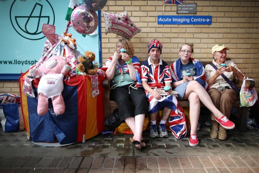 Well-wishers wait outside St Mary's Hospital for news of a royal birth.