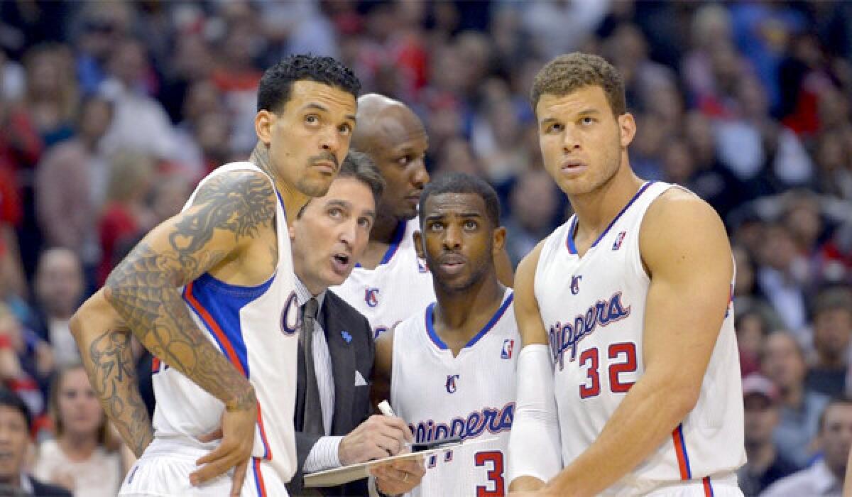 From left, the Clippers' Matt Barnes, Coach Vinny Del Negro, Lamar Odom, Chris Paul and Blake Griffin