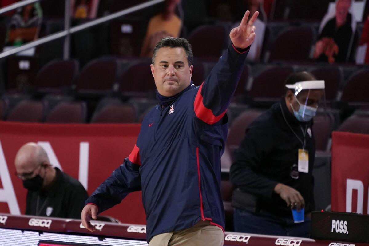 Arizona coach Sean Miller waves after a win over USC on Feb. 20, 2021, in Los Angeles. 