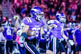 Gavin Corbet of Valencia picks up one of five interceptions for the Vikings in win over West Ranch.