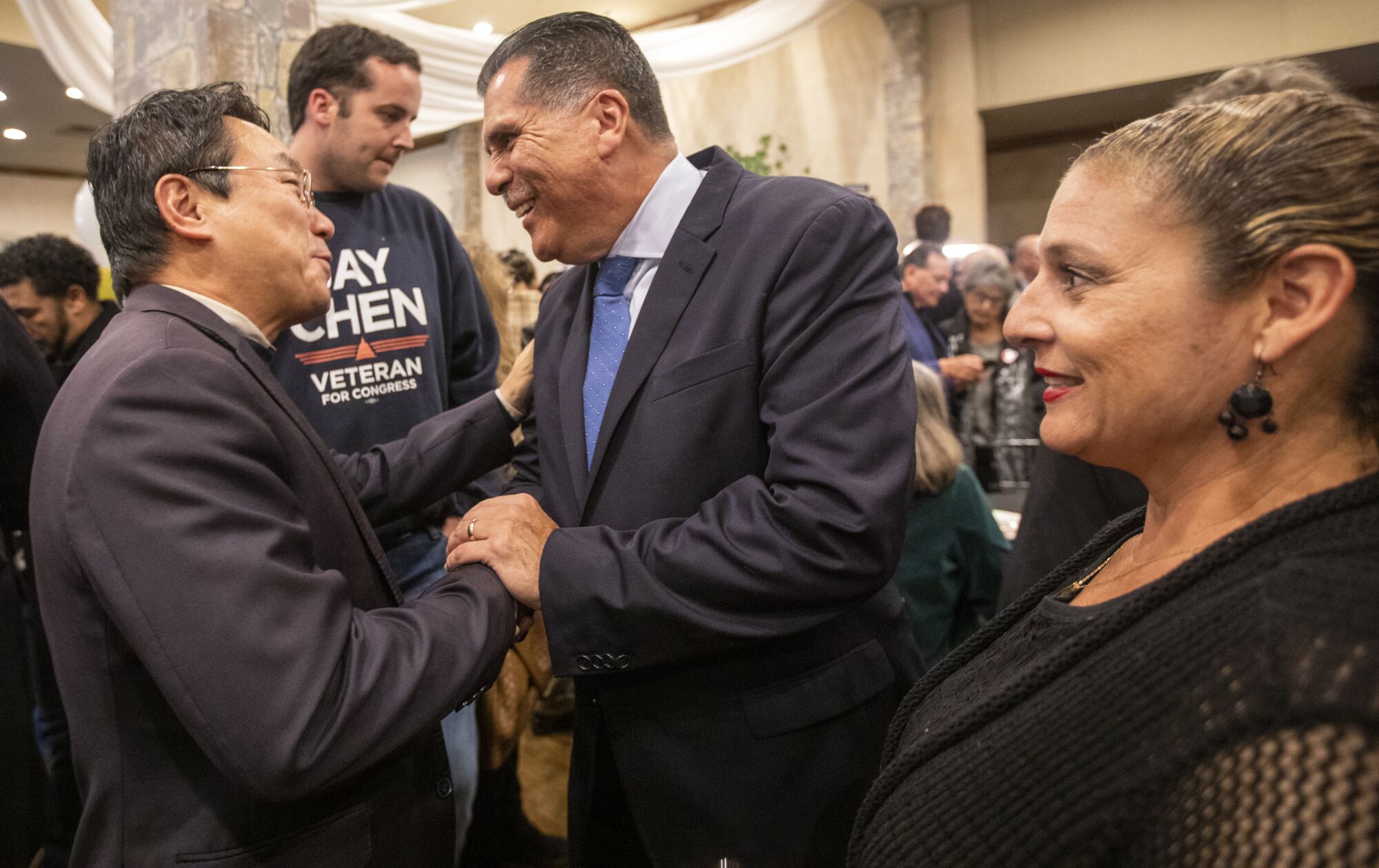 Sheriff candidate Robert Luna, middle, greets supporters on election night in Long Beach.