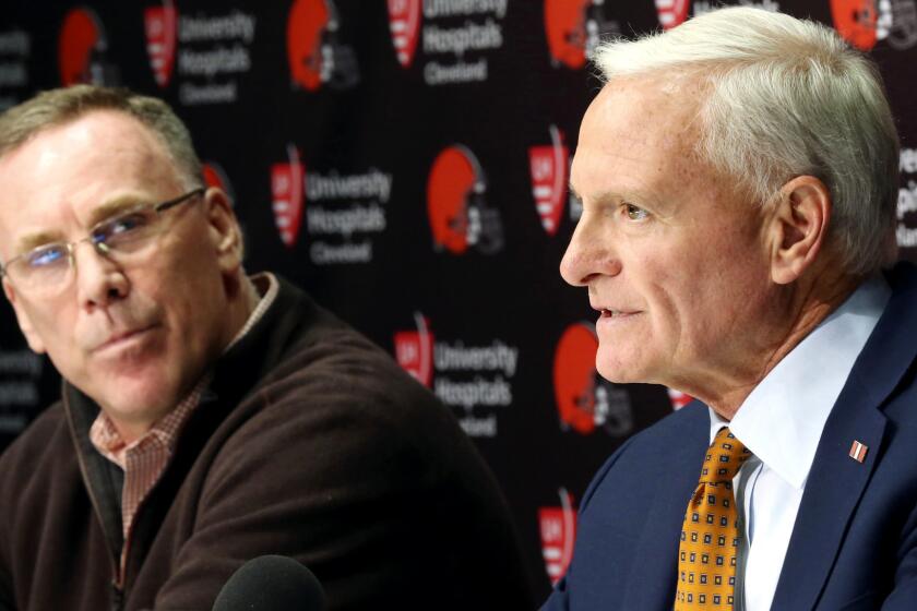 Cleveland Browns owner Jimmy Haslam, right, introduces the NFL football teams new general manager, John Dorsey, left, during an introductory press conference in Berea, Ohio, Friday, Dec. 8, 2017. (John Kuntz/The Plain Dealer via AP)