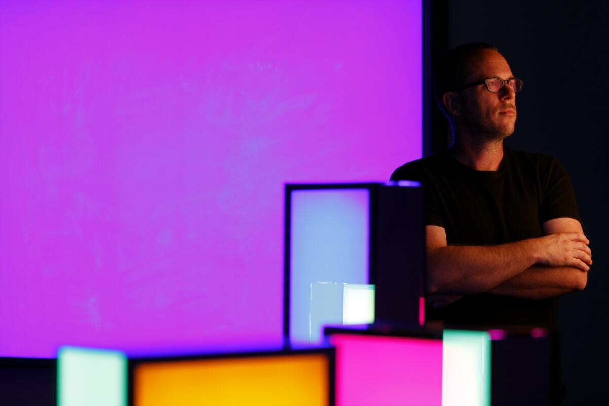 Phillip K. Smith III in his studio in Indio. He has created an elaborate light installation, "Refection Field," debuting this weekend at Coachella.