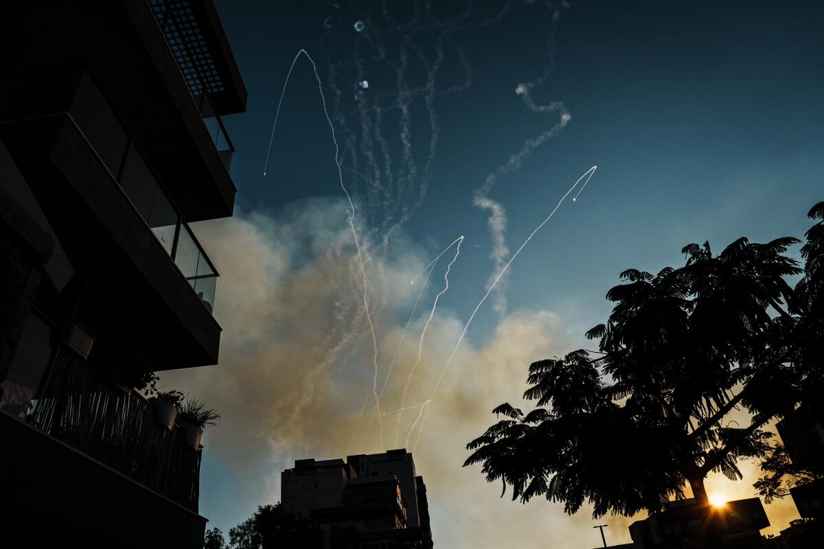 Vapor trails of rockets and smoke in a sky