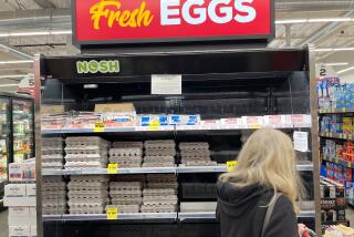 The average retail price for a dozen large eggs jumped to $7.37 in California this week, up from $4.83 at the beginning of December and just $2.35 at this time last year. A customer looks over the egg selection at Grocery Outlet Bargsain market Market in Redondo Beach on Thursday, Jan. 5, 2022. ( Jay Clendenin / Los Angeles Times )
