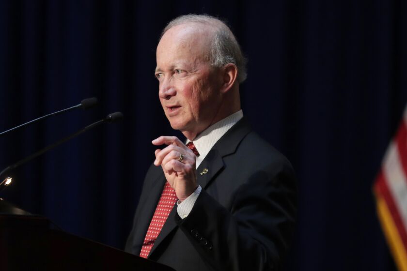 FILE - Former Indiana Gov. Mitch Daniels, president of Purdue University, delivers remarks to hundreds of mourners gathered at a memorial service honoring former U.S. Sen. Birch Bayh at the Indiana Statehouse in Indianapolis, May 1, 2019. Daniels announced Tuesday, Jan. 31, 2023, that he wouldn’t seek that state’s open U.S. Senate seat next year, ending weeks of speculation about whether the longtime Republican figure would enter a possibly vicious GOP primary fight with a combative defender of former President Donald Trump. (AP Photo/Michael Conroy, File)