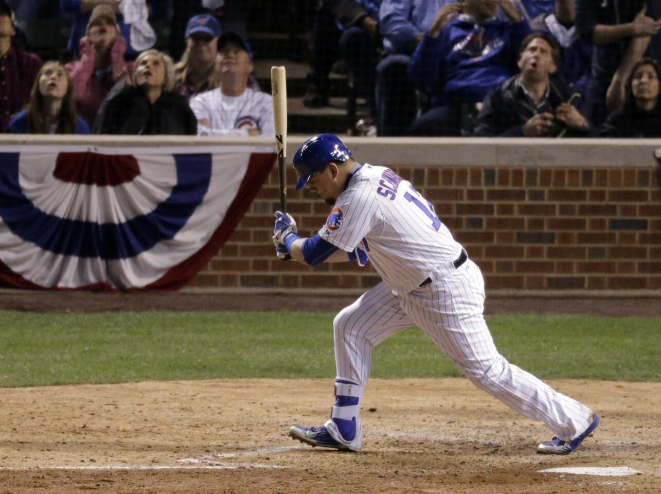 Chicago Cubs' Kyle Schwarber reacts after popping up during the eighth inning of Game 3 of the National League baseball championship series against the New York Mets Tuesday, Oct. 20, 2015, in Chicago. (AP Photo/David Goldman)