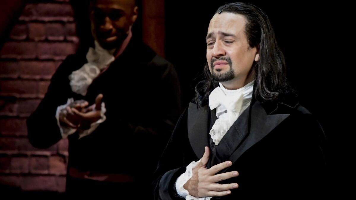 "Hamilton" creator and star Lin-Manuel Miranda receives a standing ovation with tears on opening night Friday at the Santurce Fine Arts Center in San Juan.