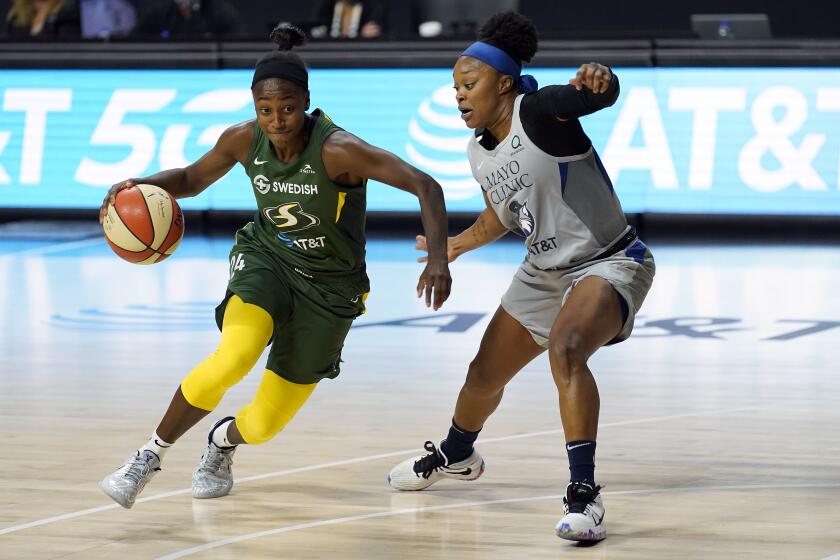 Seattle Storm guard Jewell Loyd (24) drives around Minnesota Lynx guard Odyssey Sims (1) during the second half of Game 2 of a WNBA basketball semifinal round playoff series Thursday, Sept. 24, 2020, in Bradenton, Fla. (AP Photo/Chris O'Meara)