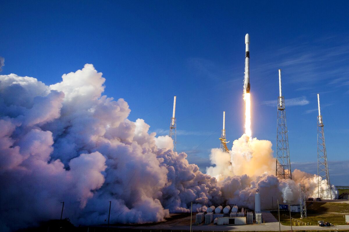 A SpaceX Falcon 9 rocket lifts off.