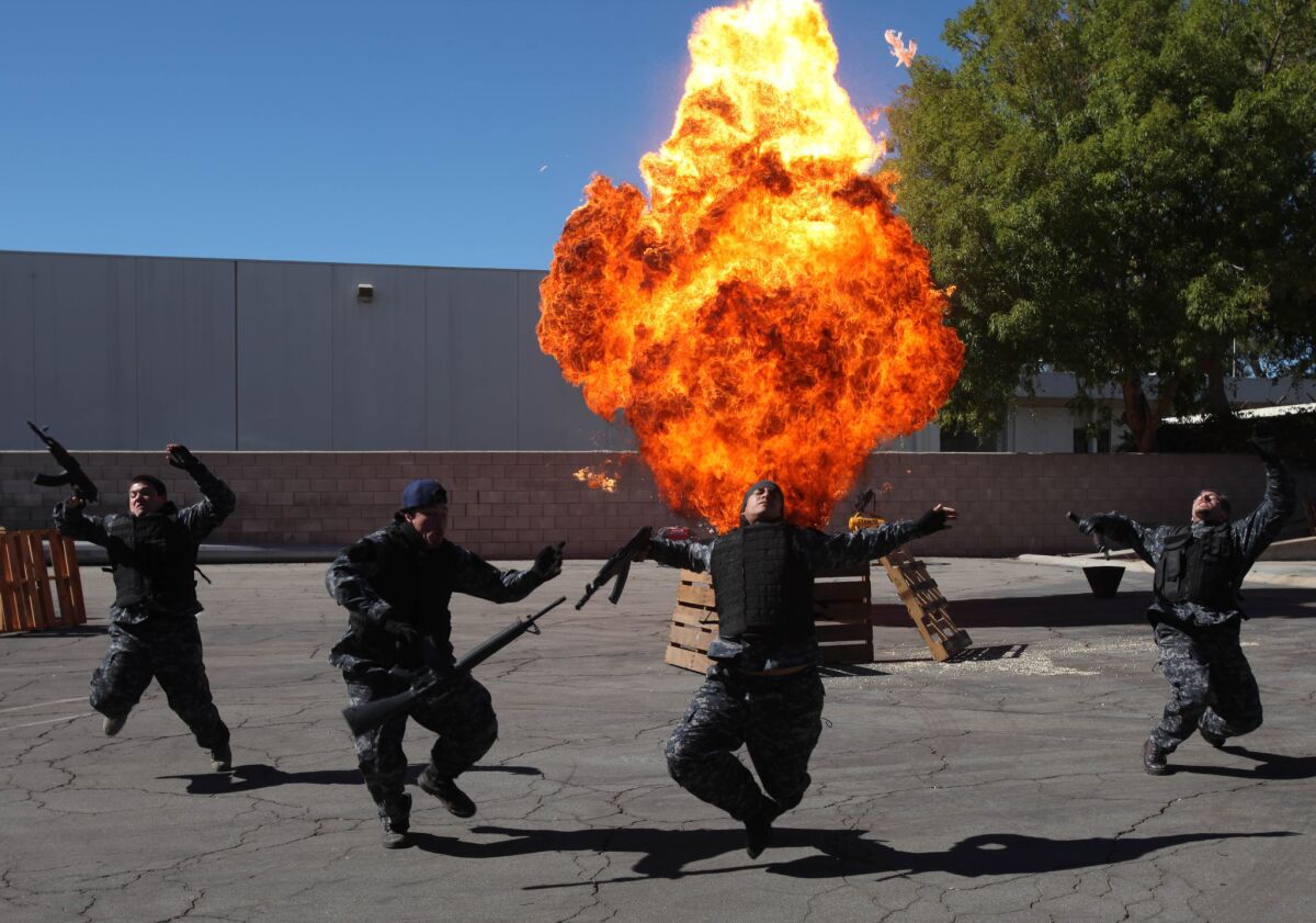 The State Fire Marshal held a three-day class to educate fire inspectors about the use of explosives on film sets. Stunt people react to an explosion during one of the scenarios.