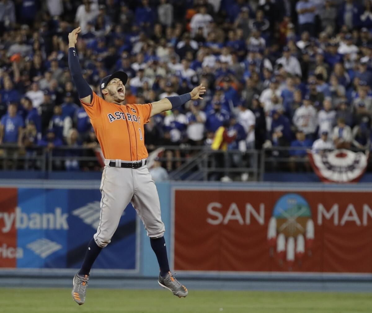 Houston Astros shortstop Carlos Correa celebrates after the Astros defeated the Los Angeles Dodgers to win the 2017 World Series.