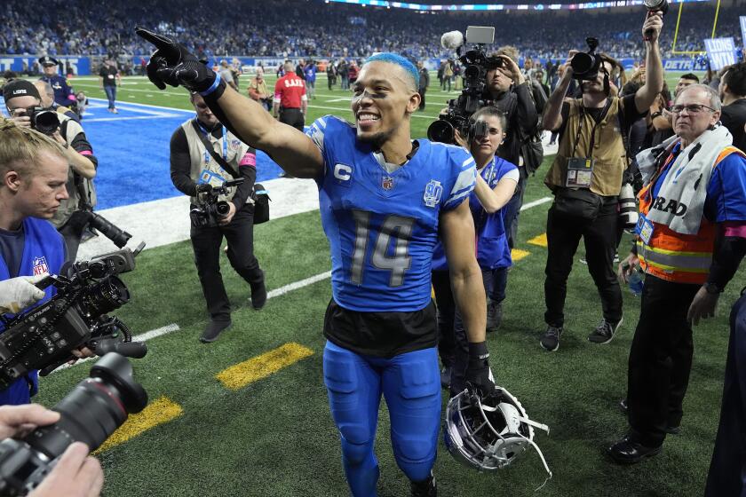 FILE - Detroit Lions wide receiver Amon-Ra St. Brown leaves the field following an NFL football NFC divisional playoff game against the Tampa Bay Buccaneers, Sunday, Jan. 21, 2024, in Detroit. The Lions and St. Brown have agreed to a four-year contract extension worth $120-plus million with $77 million in guarantees, according to a person familiar with the situation. The person spoke Wednesday, April 24, 2024, to The Associated Press on condition of anonymity because the financial terms were not announced. (AP Photo/Paul Sancya, File)