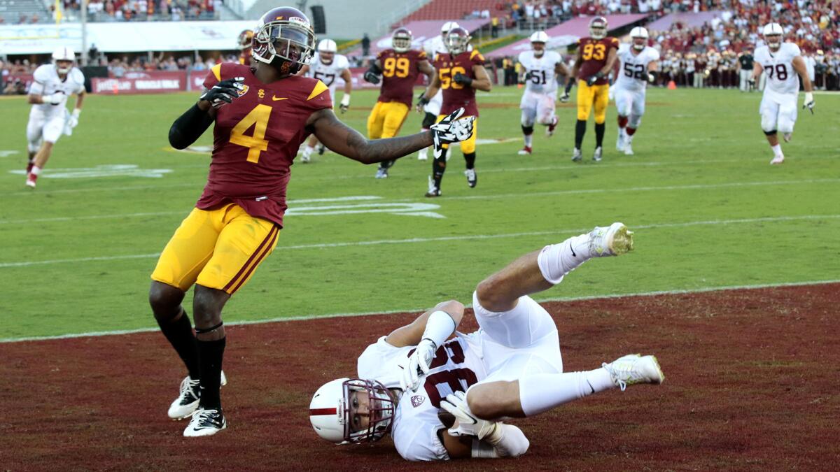 Stanford receiver Devon Cajuste hauls in a touchdown pass against USC safety Chris Hawkins with three seconds left in the second quarter Saturday.