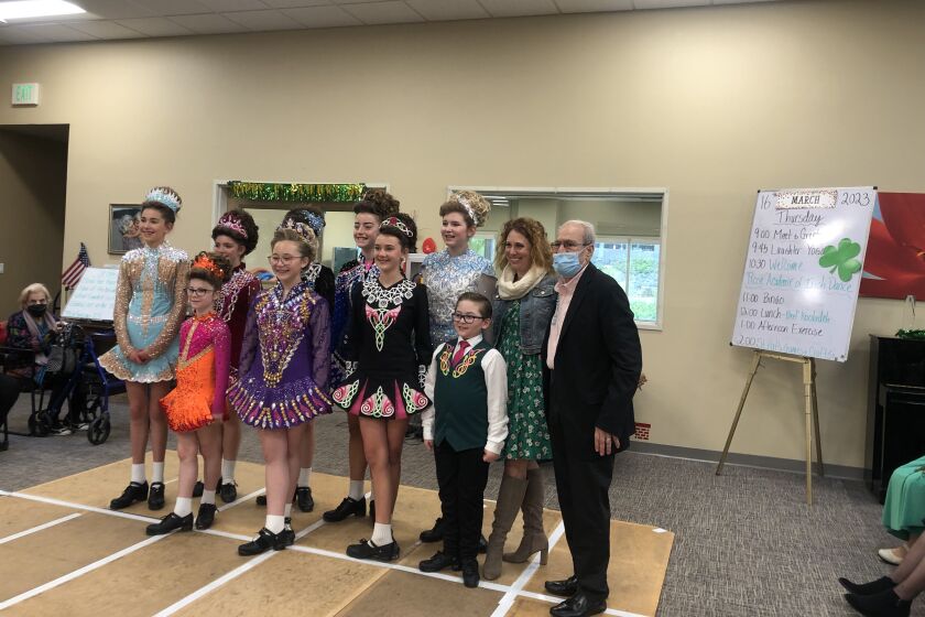 Dancers ranging from age 8 to age 13 proudly pose with Patricia Rose, owner, and Farhang M., a client of the Poway Center.