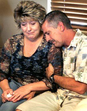 Joy and Steve Retmier of Hemet comfort each other as they discuss their 19-year-old son, Marc Retmier, a Navy hospitalman who was the 500th California fatality in the war in Iraq and Afghanistan.