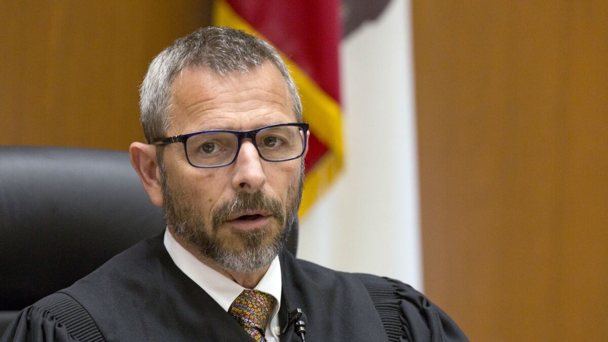 Los Angeles Superior Court Judge Gustavo N. Sztraicher reversed his order prohibiting journalists from describing the physical appearance of murder suspects seen in open court.