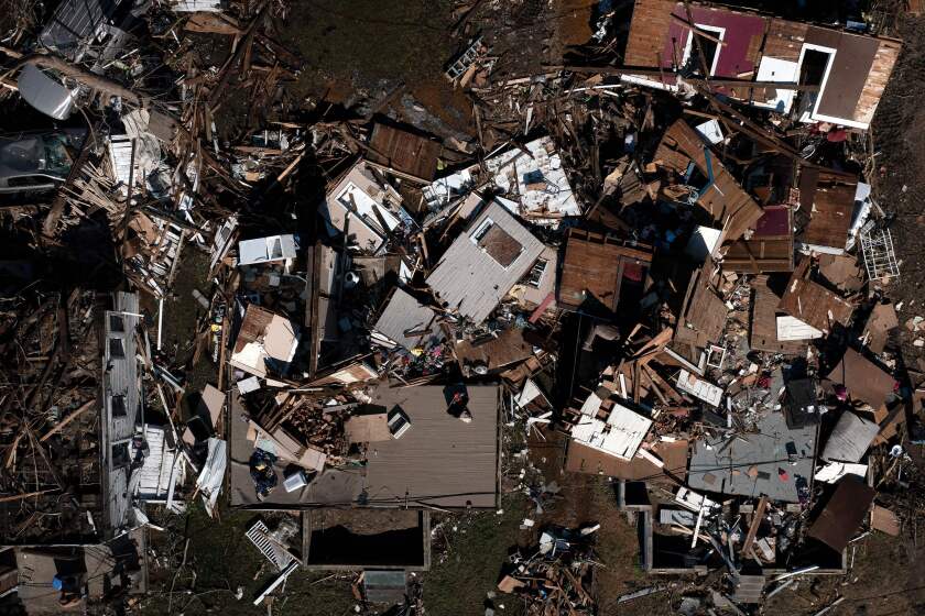 This aerial image shows tornado damage after extreme weather hit the region on December 12, 2021, in Mayfield, Kentucky. - Dozens of devastating tornadoes roared through five US states overnight, leaving more than 80 people dead on December 11, 2021 in what President Joe Biden said was "one of the largest" storm outbreaks in history. (Photo by Brendan Smialowski / AFP) (Photo by BRENDAN SMIALOWSKI/AFP via Getty Images)