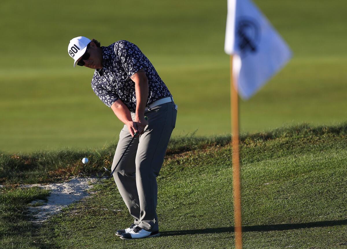 Drew Buddle of Santa Ana Country Club chips the 16th hole during the annual Jones Cup golf tournament.