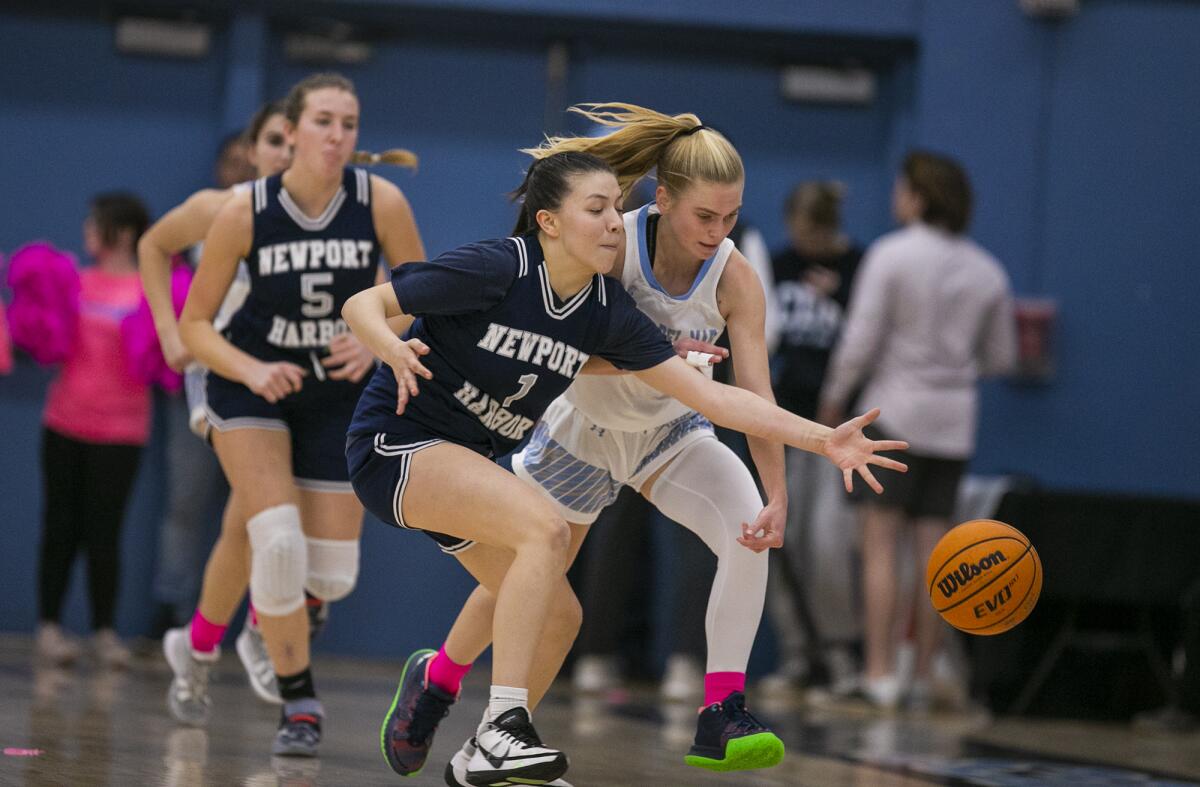 Newport Harbor's Alexia Gallegos, left, attempts to steal the ball from Corona del Mar's Alexa Rokos on Thursday.