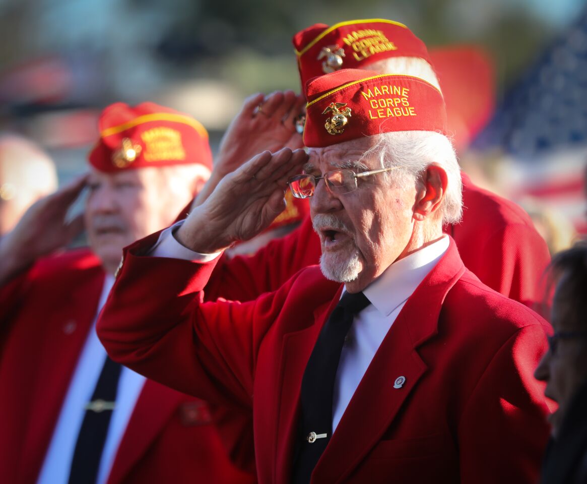 Members of the Marine Corps League salute and sing during the national anthem, at the commemoration ceremony for the 75th anniversary of the World War II Battle of Iwo Jima, February 15, at Camp Pendleton. This is the last time the Iwo Jima Commemorative Committee is planning to hold a formal West Coast gathering of veterans of the battle.