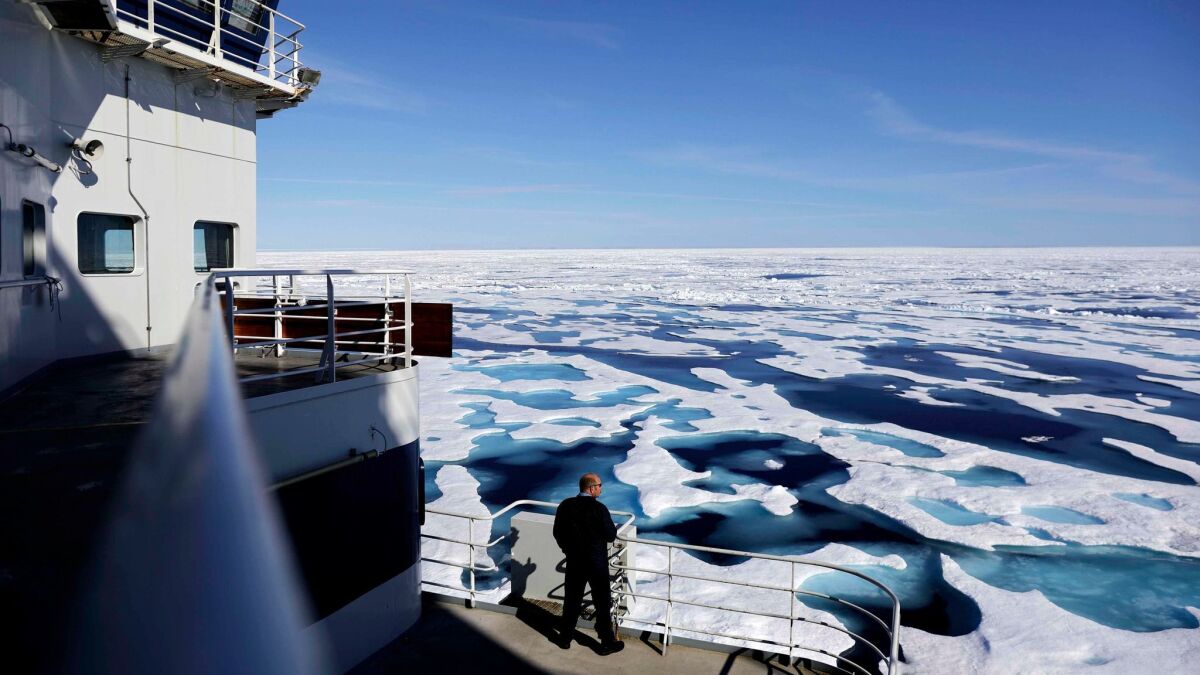 Finnish icebreaker MSV Nordica passes through Victoria Strait while transiting the Northwest Passage connecting the Pacific and Atlantic oceans earlier than had ever been recorded. (David Goldman / Associated Press)