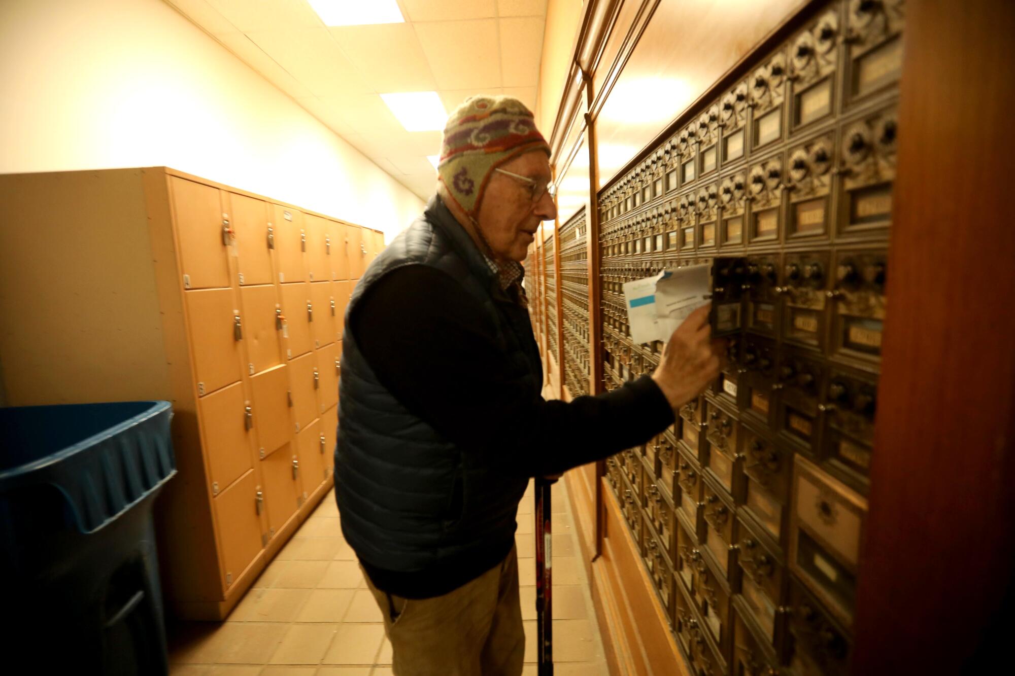 Hans Lehmann, 91, collects his mail from his post office box at the post office in downtown Carmel-by-the-Sea.