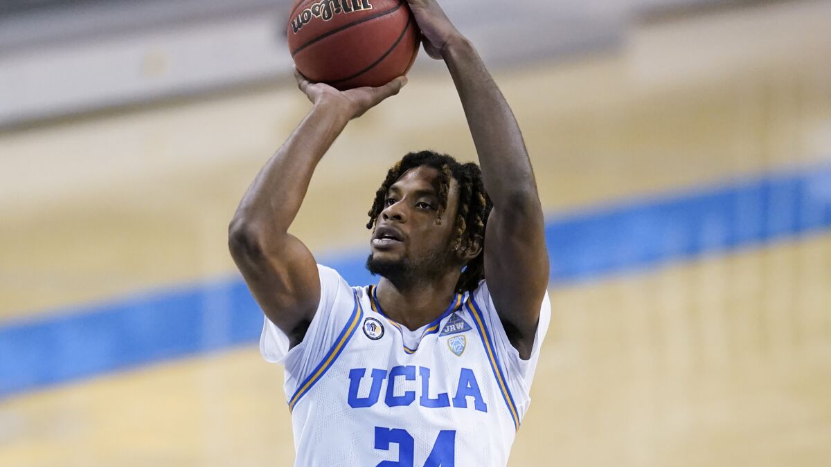 UCLA forward Jalen Hill takes a shot during a game.
