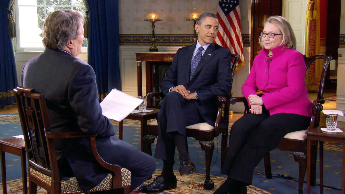 FILE - In this Jan. 25, 2013 file image taken from video and provided by CBS, President Barack Obama, center, and Secretary of State Hillary Rodham Clinton speak with ”60 Minutes” correspondent Steve Kroft, left, in the Blue Room of the White House in Washington. The interview will air Sunday, Jan. 27 during the “60 Minutes” telecast on CBS. (AP Photo/CBS, File) ** Usable by LA and DC Only **