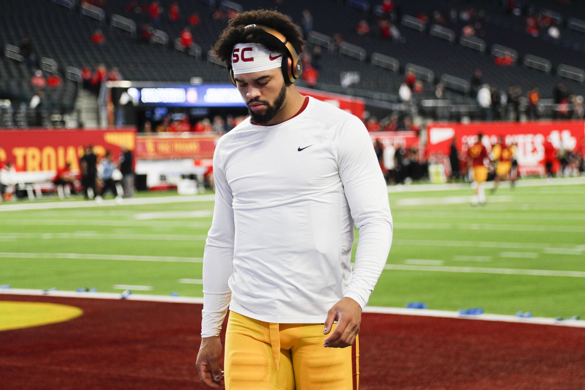 USC quarterback Caleb Williams wears headphones while warms up before the Pac-12 championship against Utah 