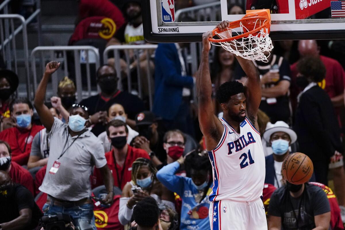 76ers center Joel Embiid dunks during the second half of Philadelphia's victory at Atlanta on June 11, 2021.