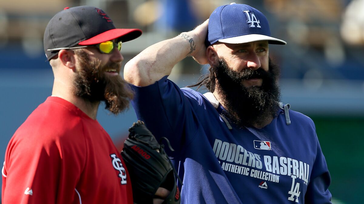 St. Louis Cardinals reliever Jason Motte, left, and Dodgers reliever Brian Wilson talk before a June 26 game at Dodger Stadium.