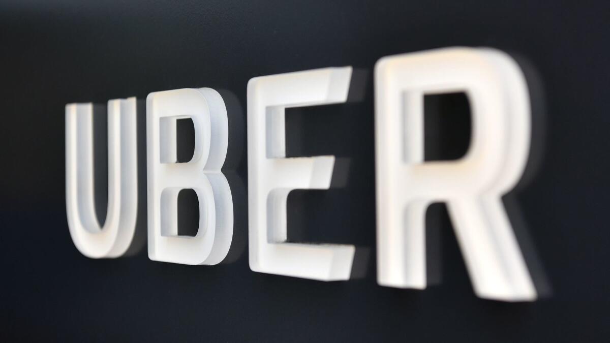 The Uber logo is seen outside the company's headquarters building in San Francisco.