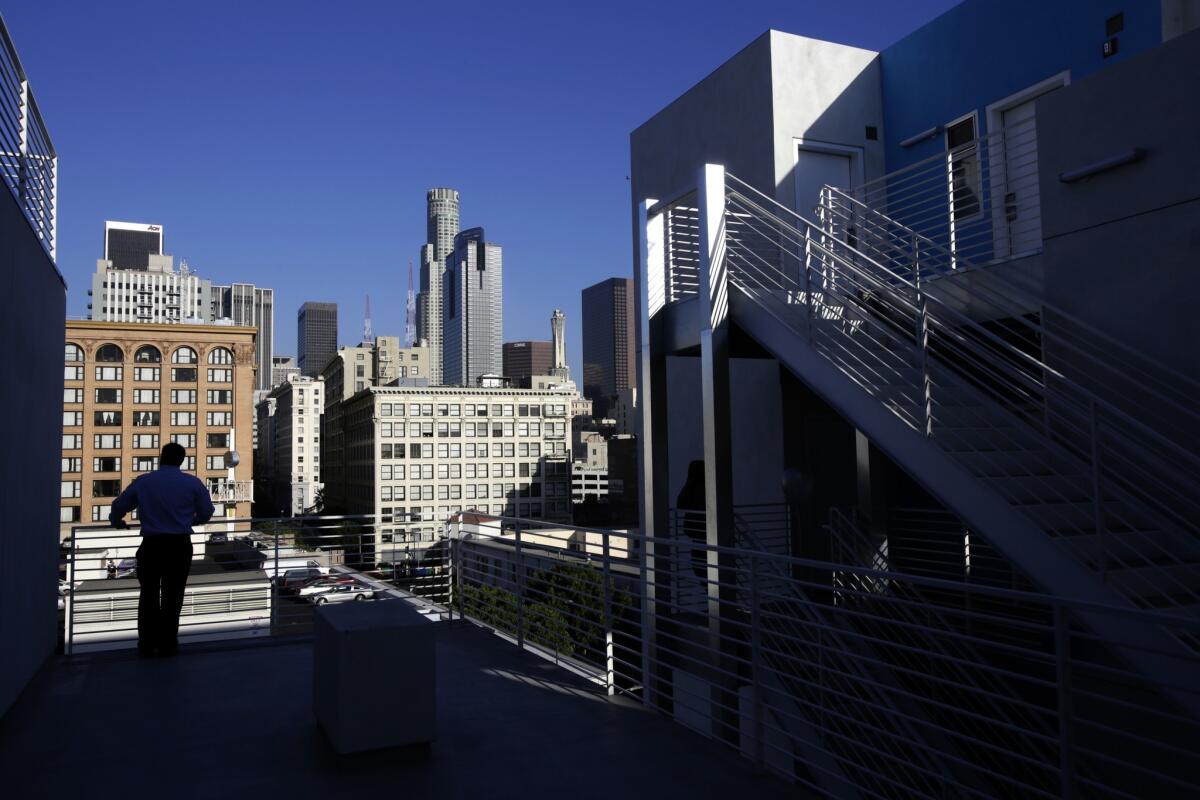 The Star Apartments building features a community garden, running track, exercise and art rooms and a library -- plus a view of the downtown L.A. skyline.
