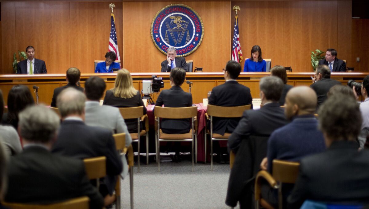 FCC Chairman Tom Wheeler, center, with commissioners Ajit Pai, left, Mignon Clyburn, Jessica Rosenworcel and Michael O'Rielly, meet Feb. 26 to vote on net neutrality regulations.