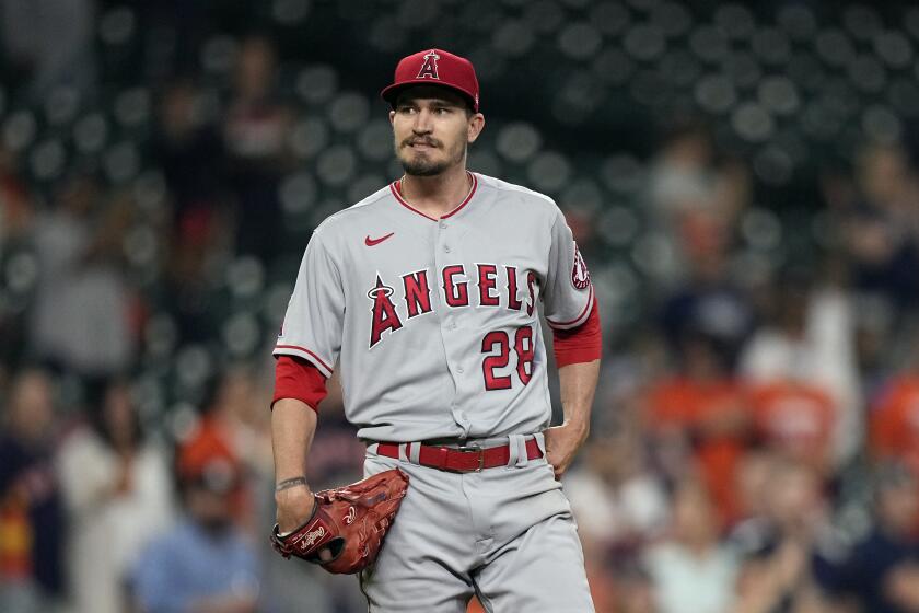 Los Angeles Angels starting pitcher Andrew Heaney (28) reacts after Houston Astros' Yuli Gurriel's two-run home run.