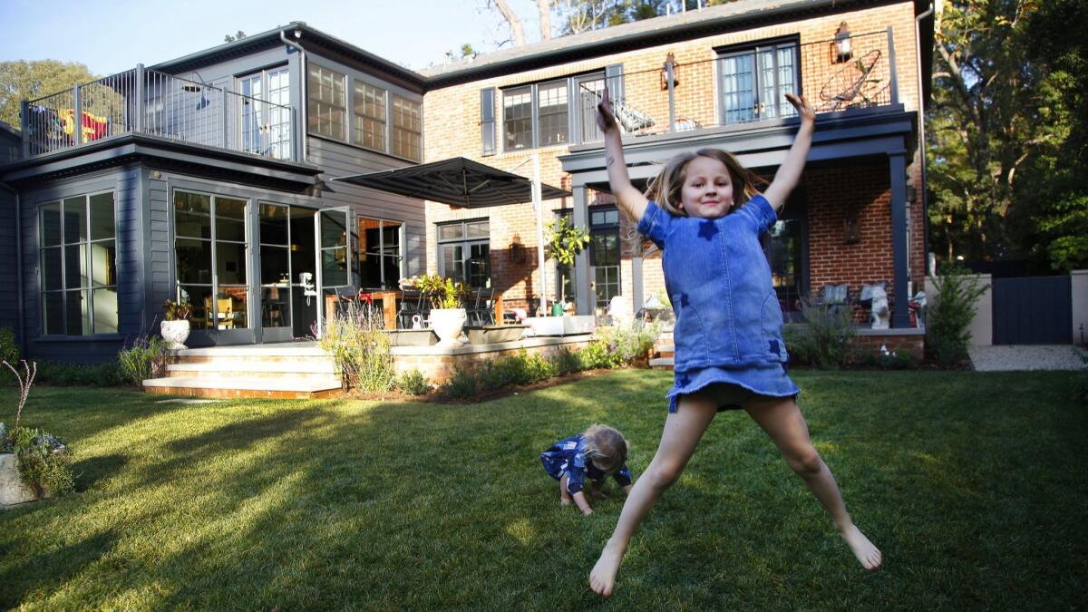 Leni Sahin, 6 and Ruby Sahin, 2, enjoy their Pasadena backyard.