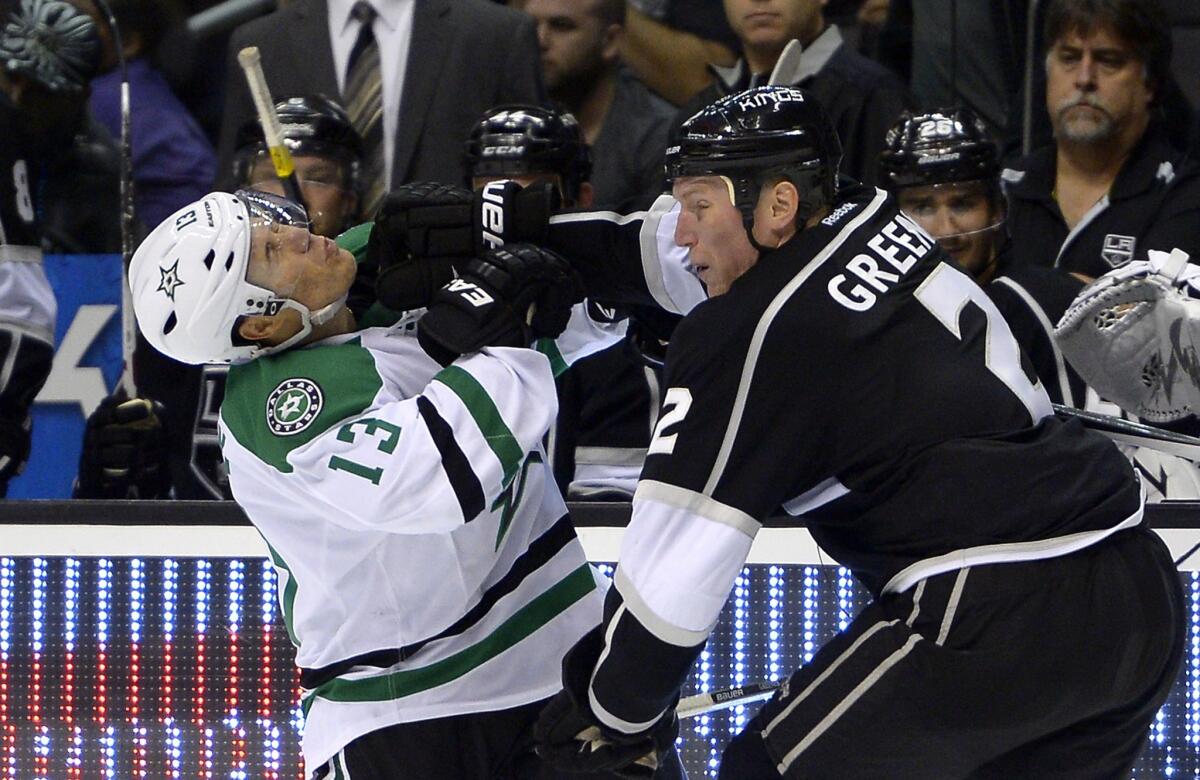 Kings defenseman Matt Greene, right, stiff-arms Dallas Stars forward Ray Whitney during a game in October. Greene appears set to return from injury this week.