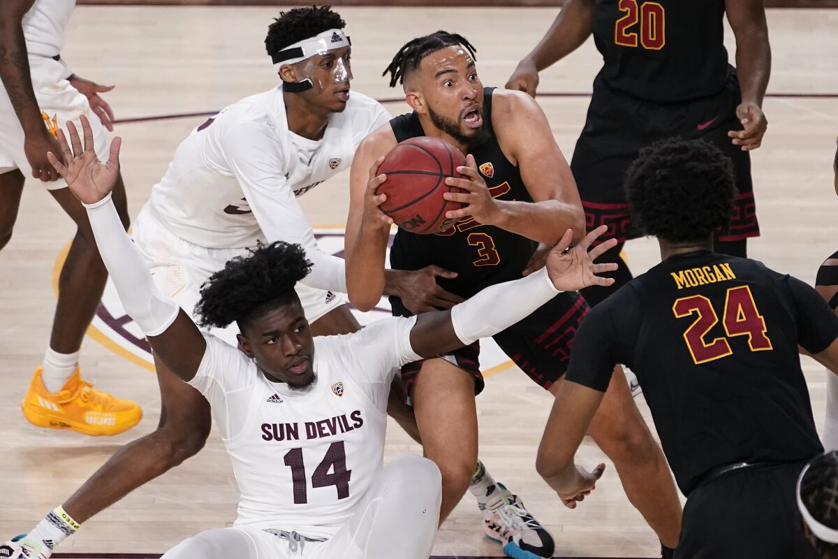 USC forward Isaiah Mobley looks to shoot as Arizona State center Enoch Boakye and forward Alonzo Gaffney defend.